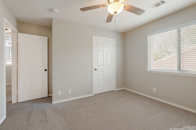 543 Willow Grove Dr, San Antonio, TX 78245 - unfurnished bedroom featuring carpet, baseboards, and ceiling fan