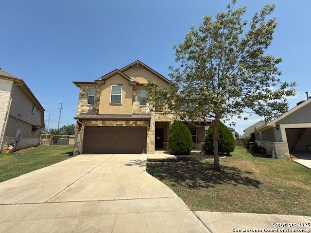 12012 Ivy Post, Schertz, TX 78154 - view of front of house with concrete driveway, a front lawn, a garage, and stone siding