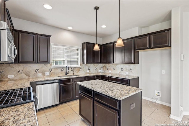 12012 Ivy Post, Schertz, TX 78154 - kitchen with appliances with stainless steel finishes, a sink, light tile patterned floors, dark brown cabinetry, and recessed lighting