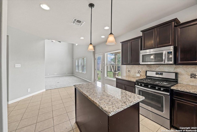 12012 Ivy Post, Schertz, TX 78154 - kitchen featuring stainless steel appliances, a center island, dark brown cabinetry, baseboards, and open floor plan