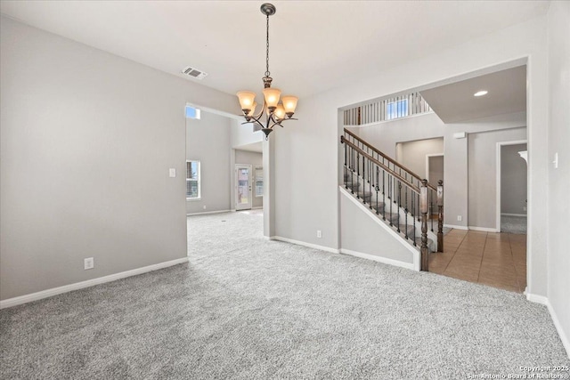 12012 Ivy Post, Schertz, TX 78154 - spare room featuring carpet floors, a chandelier, stairway, and healthy amount of natural light