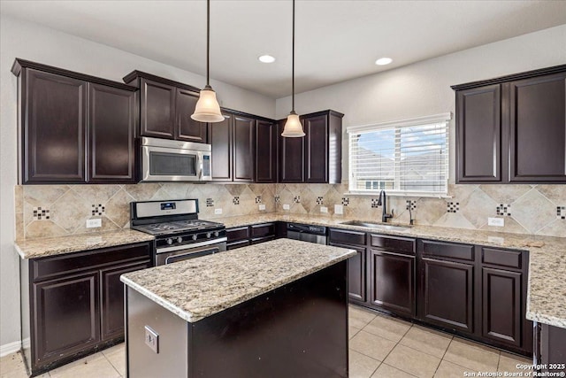 12012 Ivy Post, Schertz, TX 78154 - kitchen with a sink, appliances with stainless steel finishes, light tile patterned floors, light stone countertops, and a kitchen island