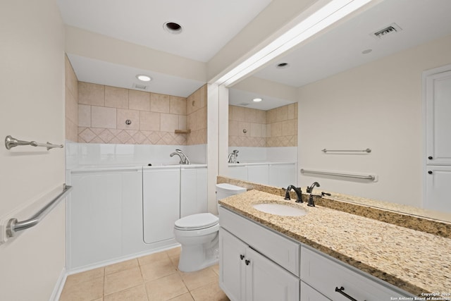 1 Towers Park Unit 1001, San Antonio, TX 78209 - full bath featuring vanity, tile patterned flooring, toilet, a bath, and a tile shower