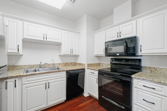 1 Towers Park Unit 1001, San Antonio, TX 78209 - kitchen featuring black appliances, a sink, dark wood-style floors, and white cabinets