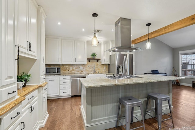 12102 Cherry Blossom, San Antonio, TX 78247 - kitchen with stainless steel appliances, island range hood, a sink, dark wood-type flooring, and a breakfast bar area