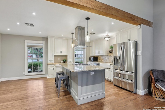 12102 Cherry Blossom, San Antonio, TX 78247 - kitchen featuring appliances with stainless steel finishes, island range hood, a sink, white cabinets, and recessed lighting