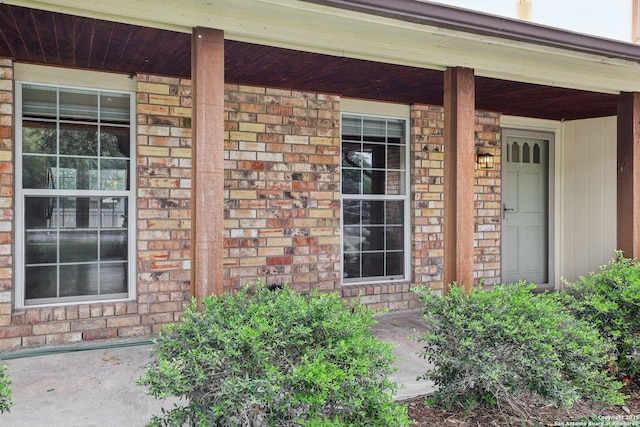 12102 Cherry Blossom, San Antonio, TX 78247 - view of exterior entry featuring covered porch and brick siding