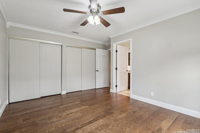 12102 Cherry Blossom, San Antonio, TX 78247 - unfurnished bedroom with multiple closets, ornamental molding, wood finished floors, baseboards, and a ceiling fan