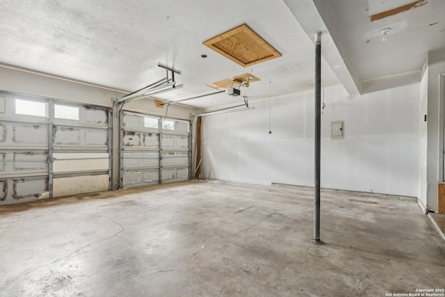 12102 Cherry Blossom, San Antonio, TX 78247 - garage featuring electric panel and a garage door opener