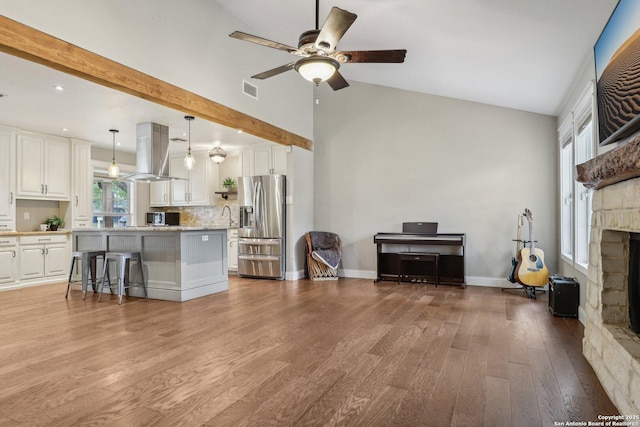 12102 Cherry Blossom, San Antonio, TX 78247 - living area with ceiling fan, light wood-style flooring, a fireplace, lofted ceiling, and recessed lighting