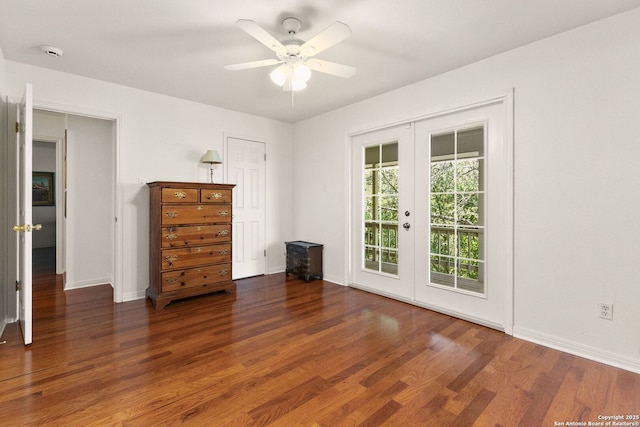557 Timber Holw, New Braunfels, TX 78132 - unfurnished room featuring french doors, wood finished floors, a ceiling fan, and baseboards
