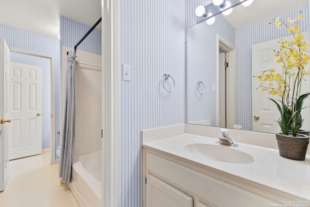 557 Timber Holw, New Braunfels, TX 78132 - full bath featuring wallpapered walls, vanity, and shower / bath combination with curtain