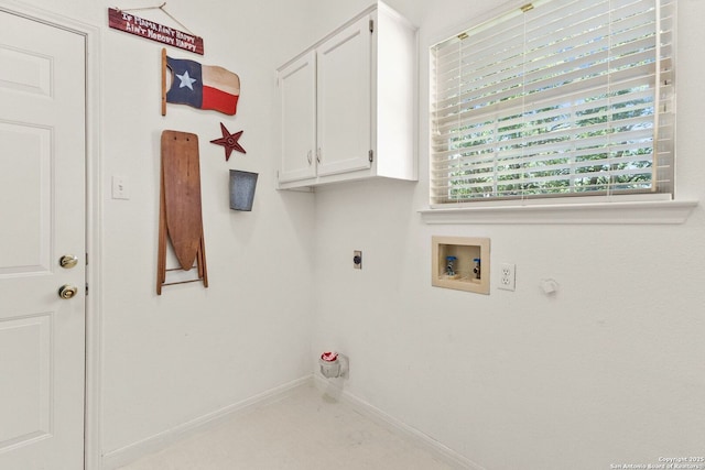 557 Timber Holw, New Braunfels, TX 78132 - washroom with cabinet space, hookup for an electric dryer, washer hookup, baseboards, and gas dryer hookup