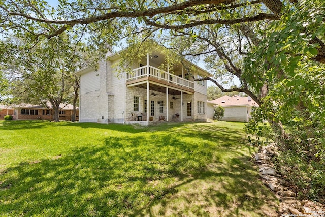 557 Timber Holw, New Braunfels, TX 78132 - rear view of house featuring a balcony, ceiling fan, a lawn, and stone siding