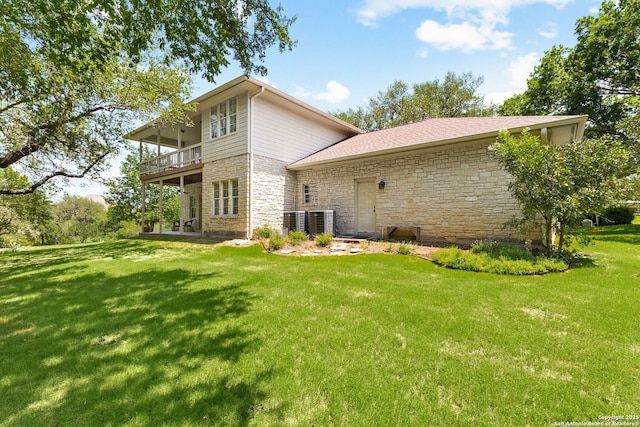 557 Timber Holw, New Braunfels, TX 78132 - back of property featuring stone siding and a yard