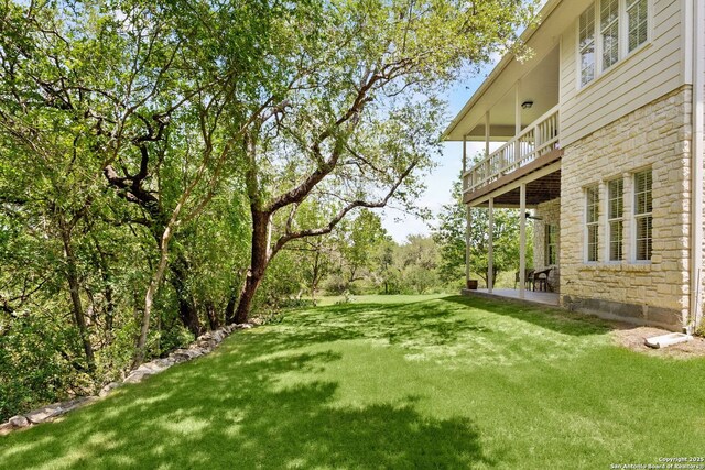 557 Timber Holw, New Braunfels, TX 78132 - view of green lawn with a balcony