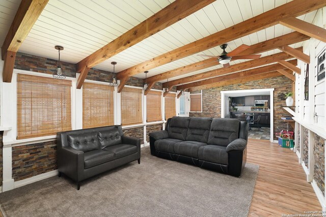 311 Redcliff, San Antonio, TX 78216 - living area featuring ceiling fan, light wood finished floors, wood ceiling with exposed beams, and brick wall
