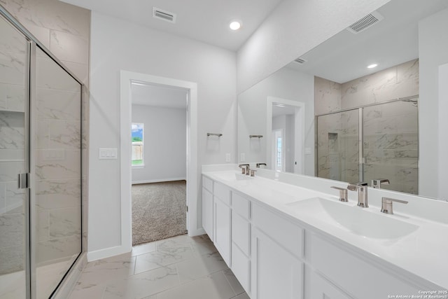 771 Fort Leonard, San Antonio, TX 78245 - full bath with marble look tile flooring, a marble finish shower, double vanity, baseboards, and recessed lighting