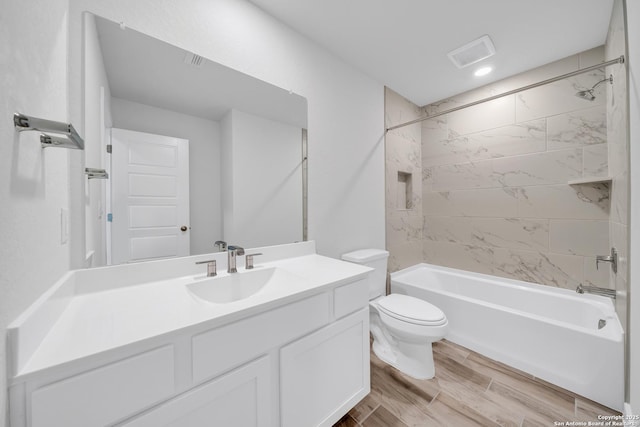 771 Fort Leonard, San Antonio, TX 78245 - full bath featuring vanity, toilet, bathtub / shower combination, wood finished floors, and recessed lighting