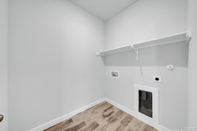 771 Fort Leonard, San Antonio, TX 78245 - laundry area with washer hookup, electric dryer hookup, light wood-style floors, baseboards, and hookup for a gas dryer