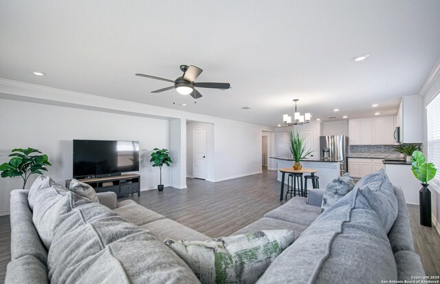 14755 Grey Egret Run, San Antonio, TX 78253 - living area featuring a chandelier, wood finished floors, ceiling fan, recessed lighting, and baseboards
