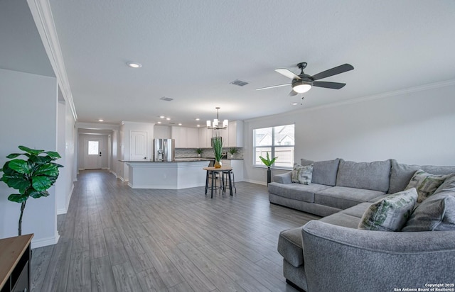 14755 Grey Egret Run, San Antonio, TX 78253 - living room with recessed lighting, a chandelier, ceiling fan, plenty of natural light, and wood finished floors