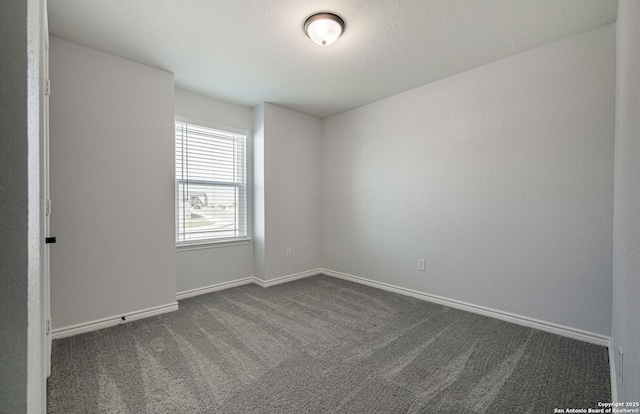 14755 Grey Egret Run, San Antonio, TX 78253 - empty room featuring dark carpet and baseboards
