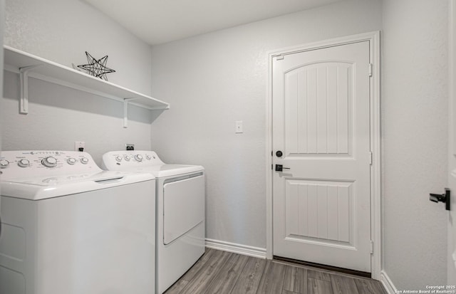 14755 Grey Egret Run, San Antonio, TX 78253 - washroom with separate washer and dryer, light wood-style flooring, and baseboards