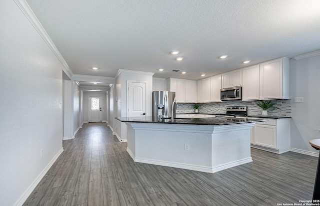 14755 Grey Egret Run, San Antonio, TX 78253 - kitchen with stainless steel appliances, crown molding, tasteful backsplash, wood finished floors, and a sink
