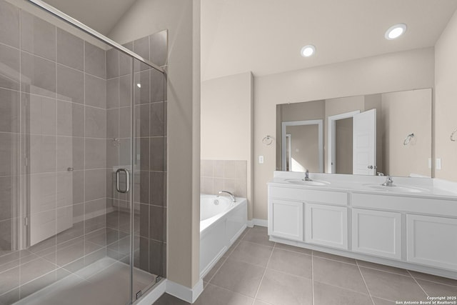 22111 Jordans Pl, San Antonio, TX 78264 - full bathroom featuring a shower stall, a garden tub, double vanity, tile patterned floors, and baseboards