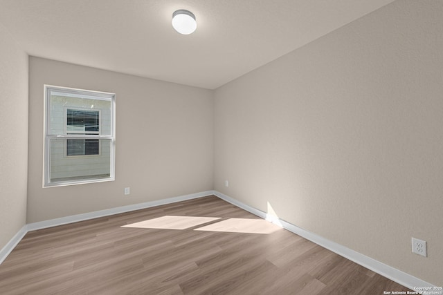 22111 Jordans Pl, San Antonio, TX 78264 - spare room featuring light wood-style flooring and baseboards