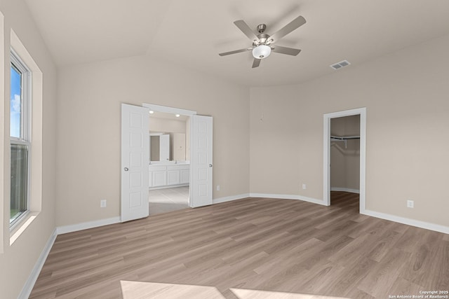 22111 Jordans Pl, San Antonio, TX 78264 - unfurnished bedroom with light wood-type flooring, baseboards, and lofted ceiling
