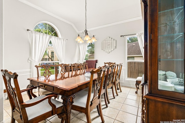 22207 Impala Peak, San Antonio, TX 78259 - dining room featuring a chandelier, ornamental molding, vaulted ceiling, light tile patterned floors, and baseboards