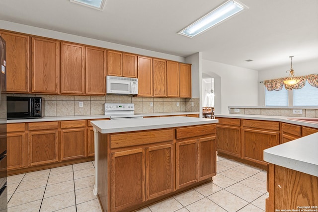 22207 Impala Peak, San Antonio, TX 78259 - kitchen featuring white appliances, light tile patterned flooring, tasteful backsplash, and light countertops