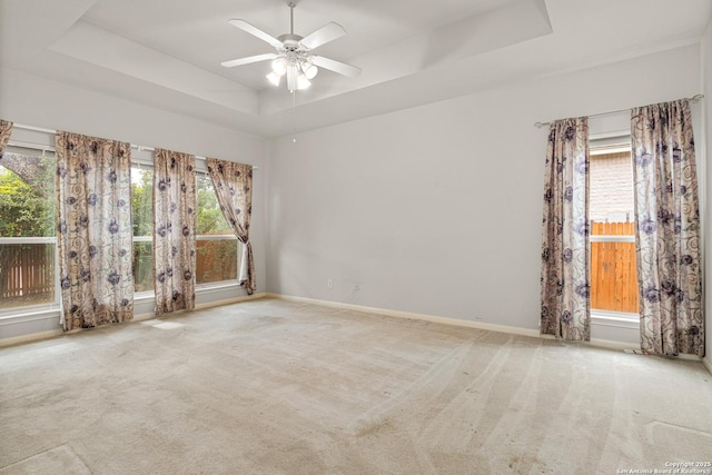 22207 Impala Peak, San Antonio, TX 78259 - empty room with a tray ceiling, ceiling fan, carpet flooring, and baseboards