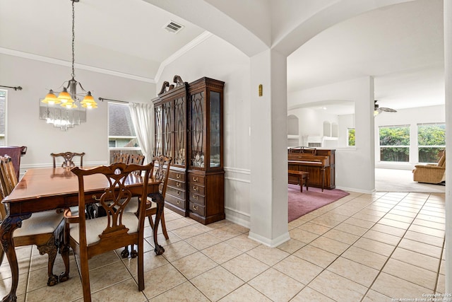 22207 Impala Peak, San Antonio, TX 78259 - dining space featuring arched walkways, light tile patterned floors, a chandelier, baseboards, and a ceiling fan