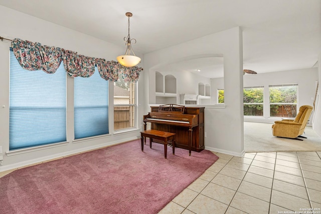 22207 Impala Peak, San Antonio, TX 78259 - living area featuring light carpet, light tile patterned flooring, and baseboards