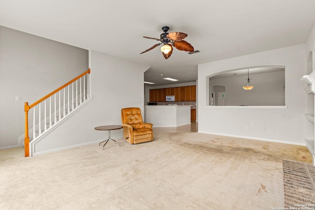 22207 Impala Peak, San Antonio, TX 78259 - unfurnished room with a ceiling fan, carpet floors, arched walkways, stairs, and baseboards