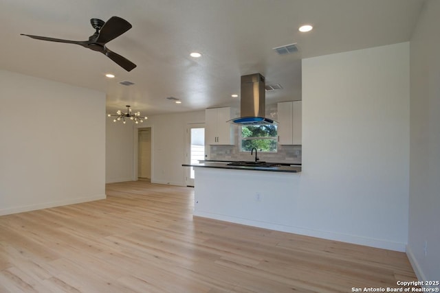 1514 Arroya Vis, San Antonio, TX 78213 - unfurnished living room featuring a chandelier, light wood-style flooring, recessed lighting, baseboards, and a ceiling fan