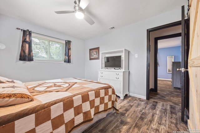 1215 Amanda, Canyon Lake, TX 78133 - bedroom with dark wood-style floors, baseboards, and ceiling fan