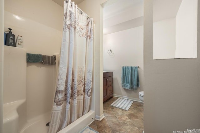 1215 Amanda, Canyon Lake, TX 78133 - bathroom with toilet, curtained shower, vanity, and baseboards