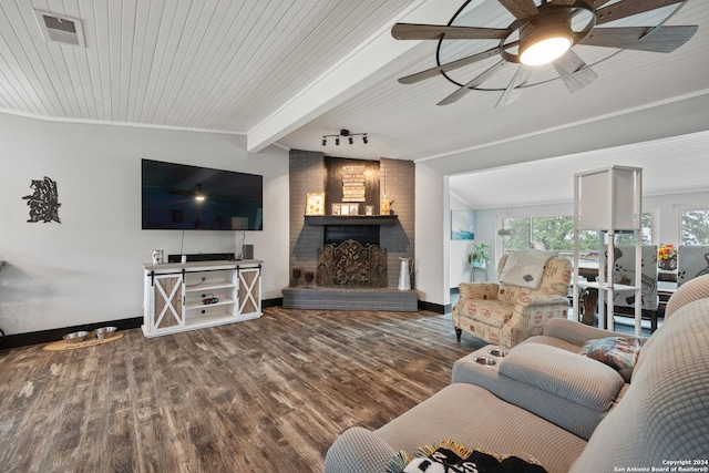 1215 Amanda, Canyon Lake, TX 78133 - living area featuring baseboards, a fireplace, wood finished floors, ceiling fan, and wooden ceiling with exposed beams