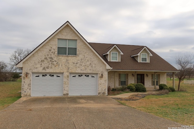 178 Spring Creek Cir, Bandera, TX 78003 - view of front facade featuring stone siding, concrete driveway, a front yard, covered porch, and roof with shingles