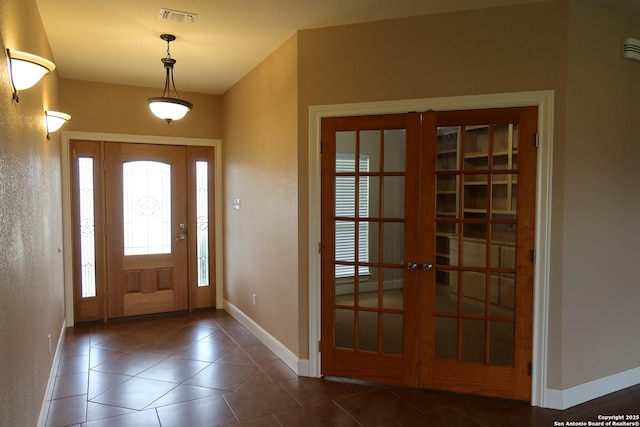178 Spring Creek Cir, Bandera, TX 78003 - tiled foyer featuring french doors, baseboards, and a textured wall