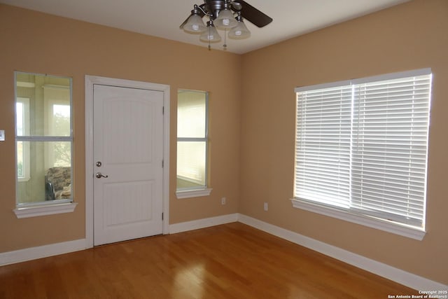 178 Spring Creek Cir, Bandera, TX 78003 - entryway with wood finished floors, a ceiling fan, and baseboards