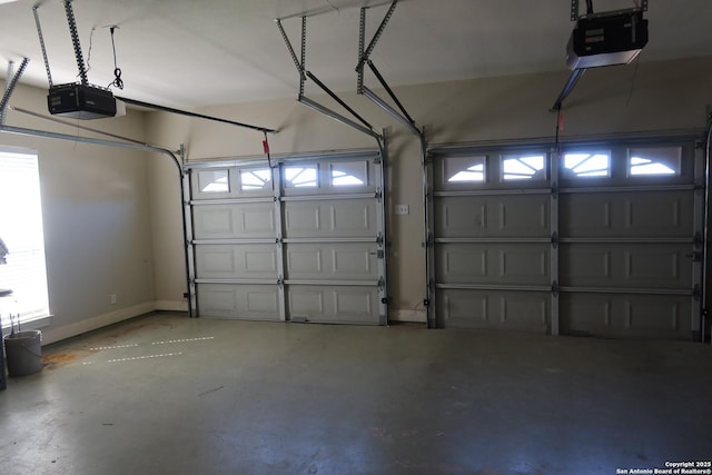 178 Spring Creek Cir, Bandera, TX 78003 - garage featuring a garage door opener and baseboards