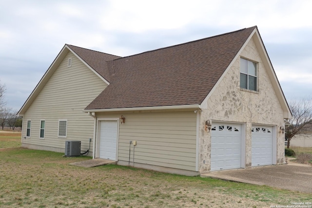 178 Spring Creek Cir, Bandera, TX 78003 - view of home's exterior featuring roof with shingles, central AC unit, and a lawn
