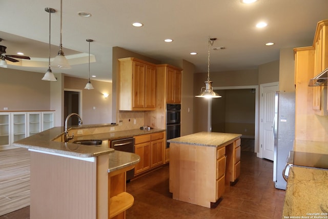 178 Spring Creek Cir, Bandera, TX 78003 - kitchen with a sink, appliances with stainless steel finishes, a kitchen island, decorative backsplash, and recessed lighting