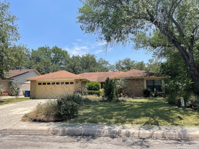 14102 Anabella, San Antonio, TX 78247 - single story home featuring brick siding, an attached garage, and a front yard