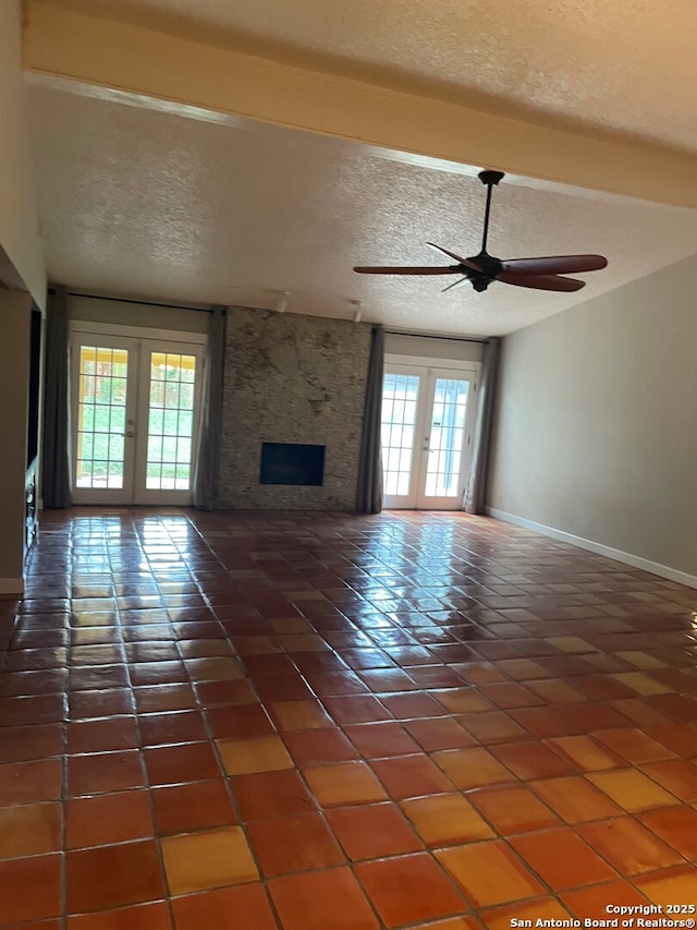 14102 Anabella, San Antonio, TX 78247 - unfurnished living room with a ceiling fan, a textured ceiling, tile patterned floors, french doors, and baseboards